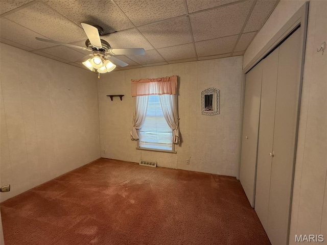 1220 W Edwards St, Vandalia, IL 62471 - unfurnished bedroom featuring carpet, a paneled ceiling, a closet, and a ceiling fan