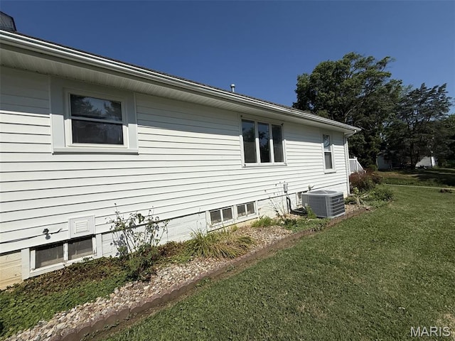 1220 W Edwards St, Vandalia, IL 62471 - view of property exterior with a central AC unit and a yard