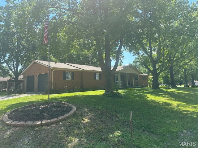 6378 High St, Moro, IL 62067 - view of grassy yard featuring a garage and driveway