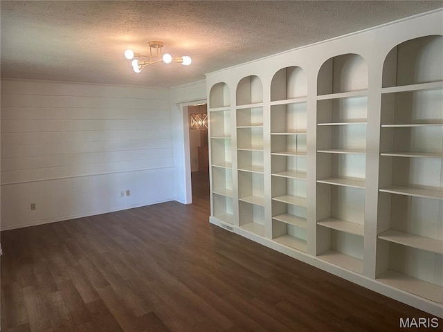 6378 High St, Moro, IL 62067 - unfurnished room with dark wood-style flooring, a textured ceiling, and a chandelier