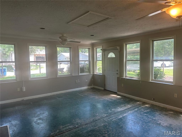 6378 High St, Moro, IL 62067 - foyer entrance featuring plenty of natural light, concrete flooring, a ceiling fan, a textured ceiling, and crown molding