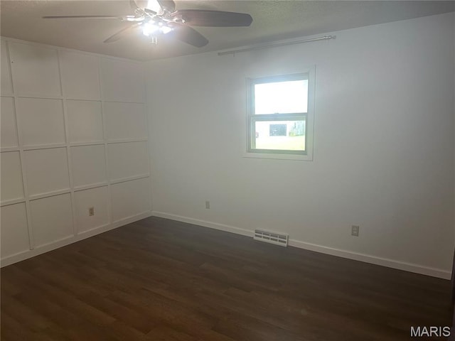 6378 High St, Moro, IL 62067 - unfurnished room with ceiling fan and dark wood-style floors