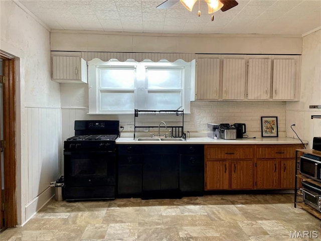 204 E Columbia St, Litchfield, IL 62056 - kitchen with black range with gas stovetop, light countertops, a ceiling fan, stainless steel microwave, and light stone finish flooring