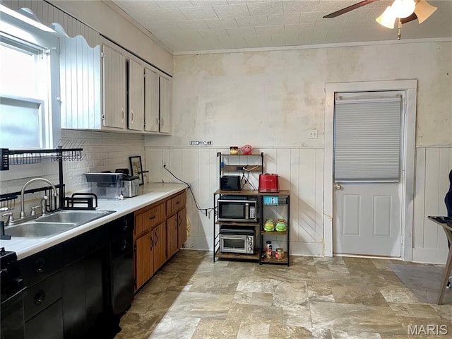 204 E Columbia St, Litchfield, IL 62056 - kitchen with ceiling fan, crown molding, light countertops, light stone finish floors, and wainscoting