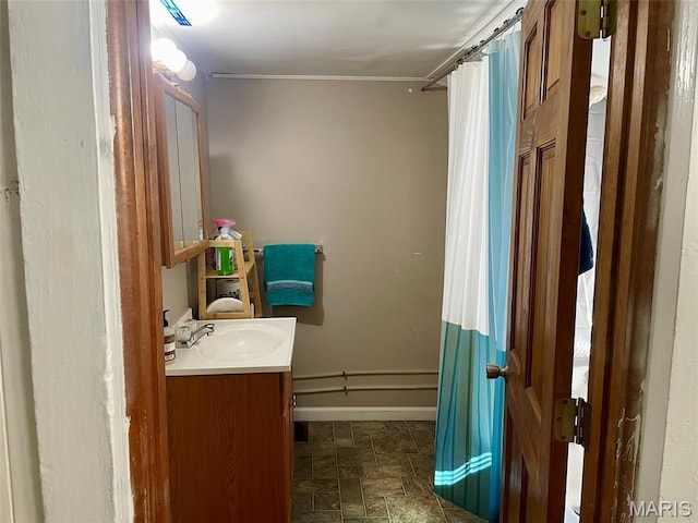 204 E Columbia St, Litchfield, IL 62056 - bathroom with vanity, stone finish flooring, curtained shower, and crown molding