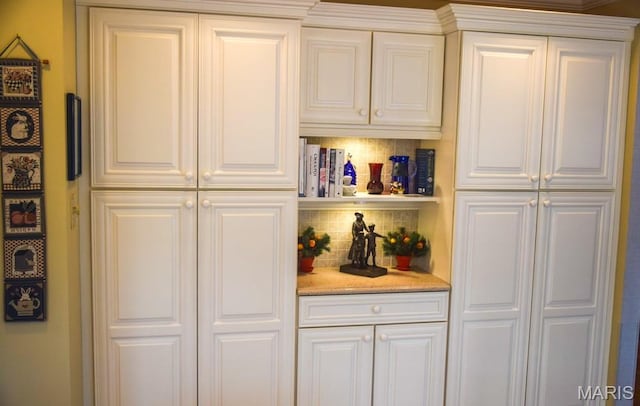 1741 Ivy Chase Ct, Fenton, MO 63026 - kitchen featuring decorative backsplash, white cabinetry, and light stone countertops