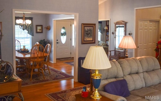 1741 Ivy Chase Ct, Fenton, MO 63026 - living area with a chandelier and wood finished floors