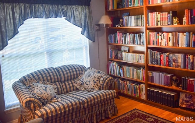 1741 Ivy Chase Ct, Fenton, MO 63026 - living area with wood finished floors and wall of books