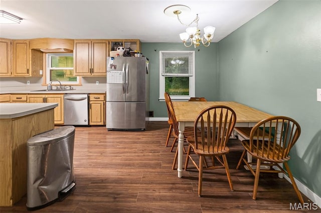 1752 N Bluff Rd, Collinsville, IL 62234 - kitchen featuring appliances with stainless steel finishes, a chandelier, light countertops, dark wood-style flooring, and light brown cabinets