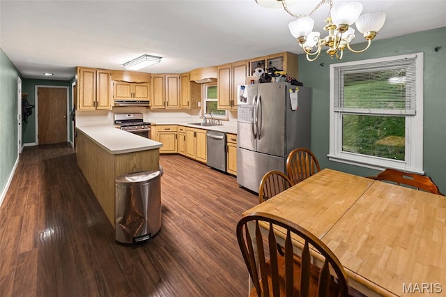 1752 N Bluff Rd, Collinsville, IL 62234 - kitchen featuring stainless steel appliances, under cabinet range hood, plenty of natural light, and a peninsula