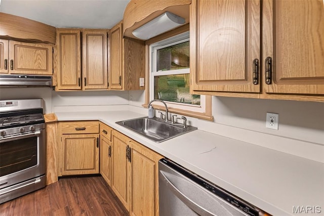 1752 N Bluff Rd, Collinsville, IL 62234 - kitchen with appliances with stainless steel finishes, under cabinet range hood, light countertops, and dark wood finished floors