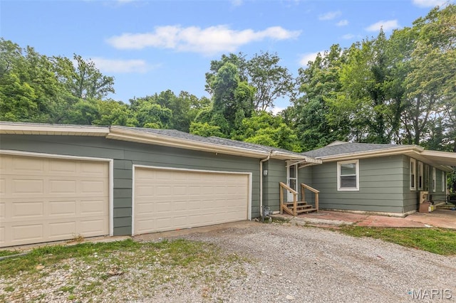 1752 N Bluff Rd, Collinsville, IL 62234 - ranch-style home featuring gravel driveway and an attached garage