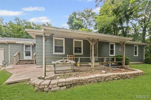 1752 N Bluff Rd, Collinsville, IL 62234 - back of property with a yard, entry steps, and a patio area