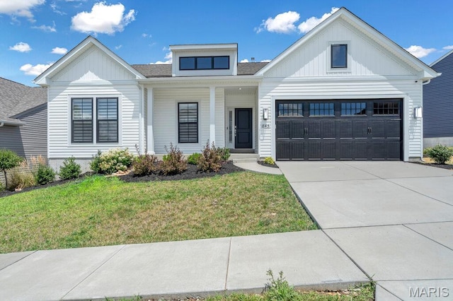 845 Kingston Hills Ct, Fenton, MO 63026 - view of front facade featuring board and batten siding, a front yard, driveway, an attached garage, and a shingled roof