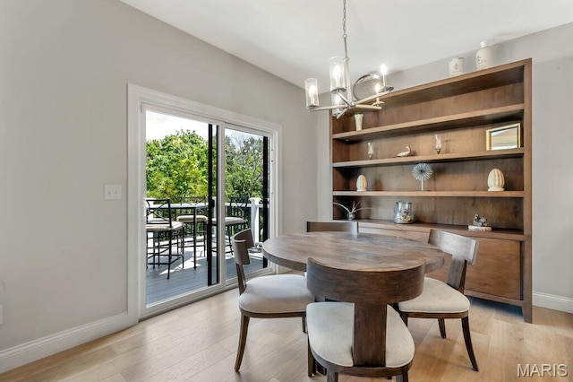 845 Kingston Hills Ct, Fenton, MO 63026 - dining space featuring a chandelier and light wood-style flooring