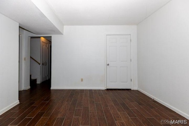 916 Kansas St, Mountain View, MO 65548 - spare room featuring dark wood-style flooring and stairway