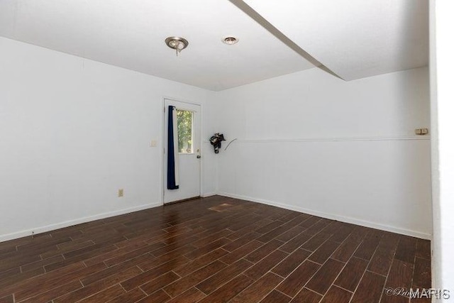 916 Kansas St, Mountain View, MO 65548 - unfurnished room featuring dark wood-style flooring and baseboards