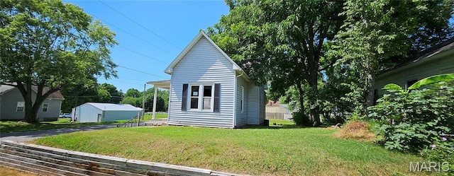 718 2nd St W, Scott City, MO 63780 - view of home's exterior featuring a yard and an outbuilding