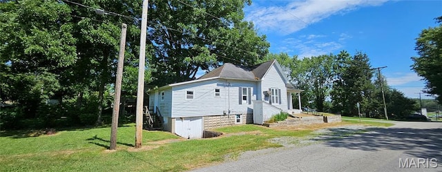 718 2nd St W, Scott City, MO 63780 - view of property exterior featuring a yard and view of scattered trees