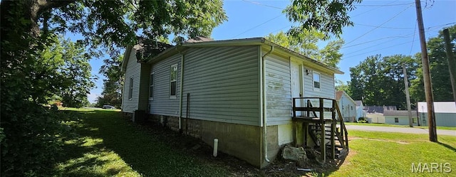 718 2nd St W, Scott City, MO 63780 - view of property exterior with a lawn and stairway