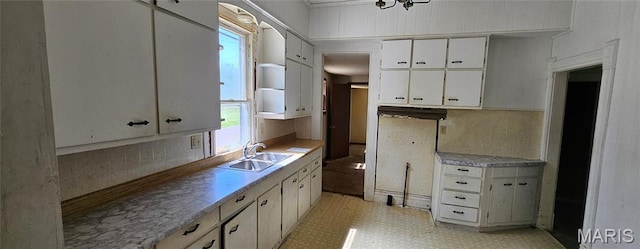 718 2nd St W, Scott City, MO 63780 - kitchen featuring light countertops, white cabinetry, and light flooring
