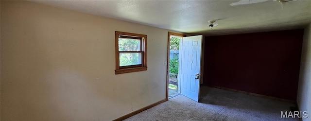 718 2nd St W, Scott City, MO 63780 - carpeted empty room with baseboards