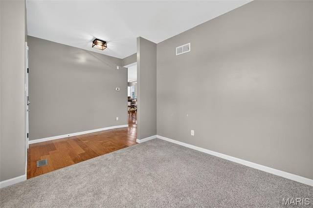 907 Wilderness Way Dr, Eureka, MO 63025 - carpeted empty room with baseboards and wood finished floors
