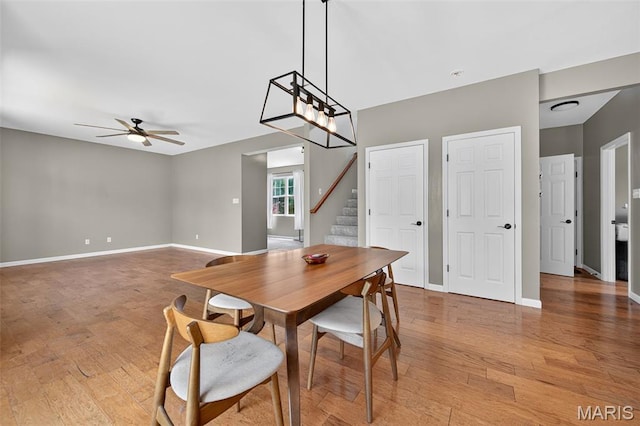 907 Wilderness Way Dr, Eureka, MO 63025 - dining space with ceiling fan, stairs, and light wood-style flooring