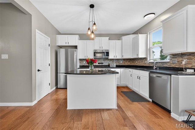 907 Wilderness Way Dr, Eureka, MO 63025 - kitchen featuring appliances with stainless steel finishes, decorative backsplash, and dark countertops