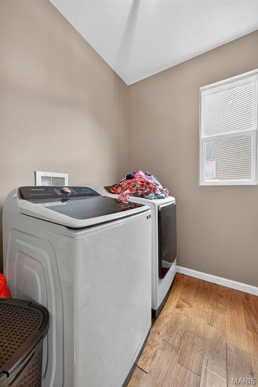 907 Wilderness Way Dr, Eureka, MO 63025 - laundry room with separate washer and dryer and light wood-style flooring
