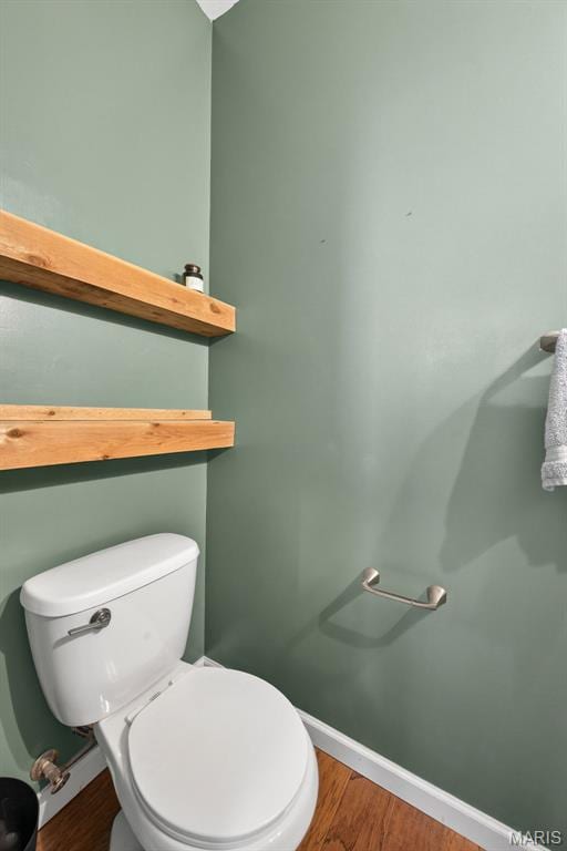 907 Wilderness Way Dr, Eureka, MO 63025 - half bathroom featuring toilet and wood finished floors