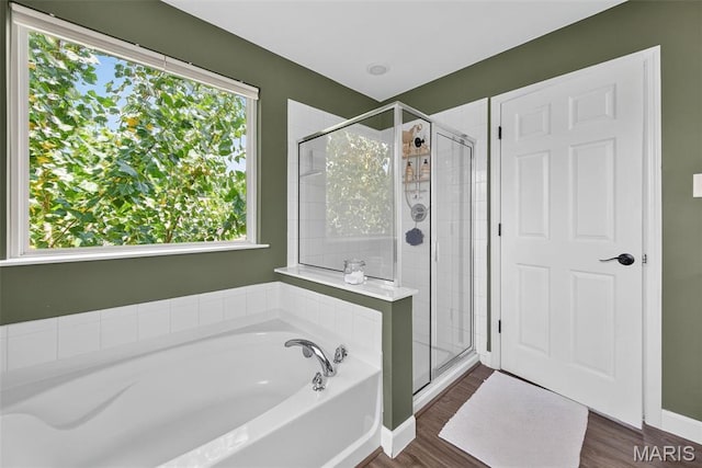 907 Wilderness Way Dr, Eureka, MO 63025 - full bathroom featuring a garden tub, a stall shower, and wood finished floors