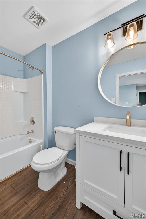 907 Wilderness Way Dr, Eureka, MO 63025 - full bathroom with vanity, tub / shower combination, and wood finished floors
