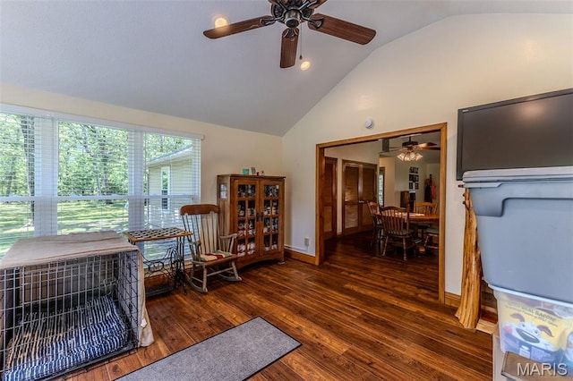 living area with ceiling fan, wood finished floors, and high vaulted ceiling