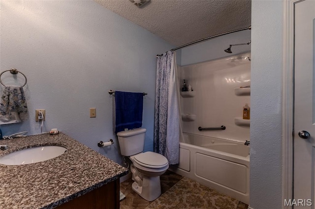 bathroom with vanity, shower / bath combo with shower curtain, and a textured ceiling