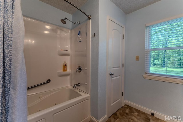 full bath with a textured ceiling and shower / bathtub combination with curtain
