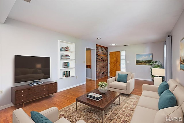 65 Harmon Dr, Lebanon, IL 62254 - living area featuring wood finished floors and built in shelves