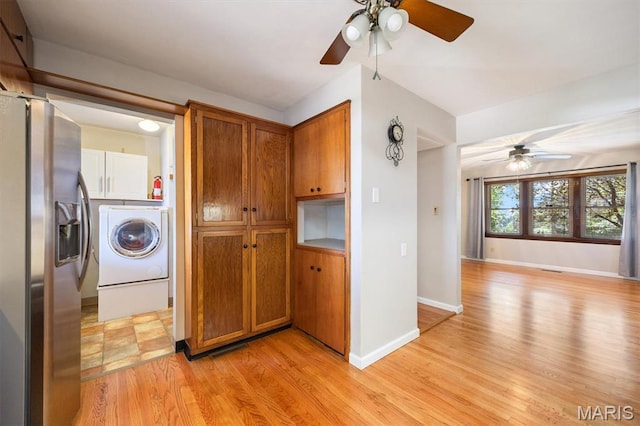 65 Harmon Dr, Lebanon, IL 62254 - kitchen featuring stainless steel refrigerator with ice dispenser, a ceiling fan, brown cabinetry, and washer / dryer