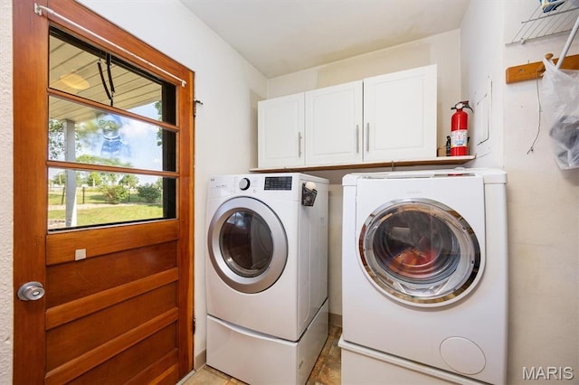65 Harmon Dr, Lebanon, IL 62254 - laundry area with washer and dryer and cabinet space