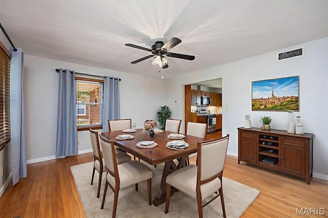 65 Harmon Dr, Lebanon, IL 62254 - dining room with light wood-style flooring and ceiling fan