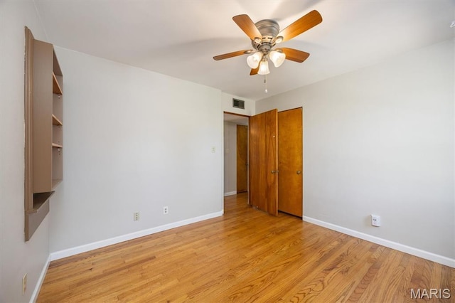 65 Harmon Dr, Lebanon, IL 62254 - spare room featuring light wood-style floors and ceiling fan
