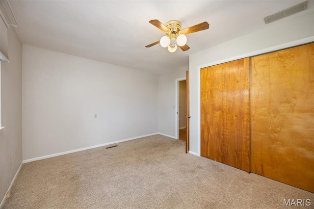 65 Harmon Dr, Lebanon, IL 62254 - unfurnished bedroom with carpet flooring, a closet, and ceiling fan