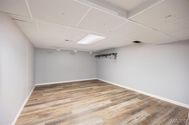 65 Harmon Dr, Lebanon, IL 62254 - finished below grade area with light wood finished floors and a paneled ceiling