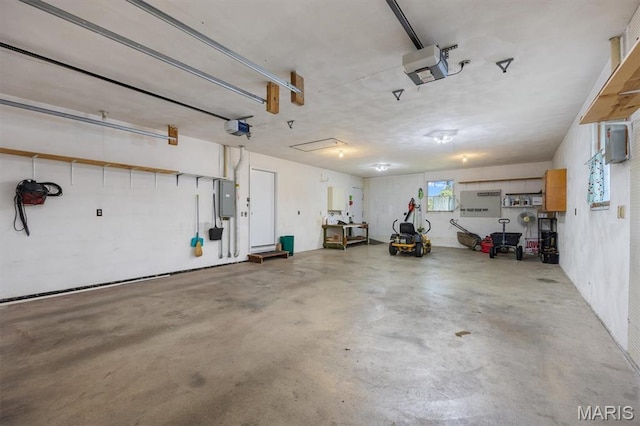 65 Harmon Dr, Lebanon, IL 62254 - garage with a garage door opener and electric panel