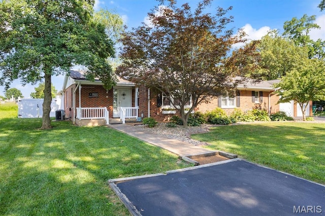 65 Harmon Dr, Lebanon, IL 62254 - view of front of home with a front yard, covered porch, and brick siding
