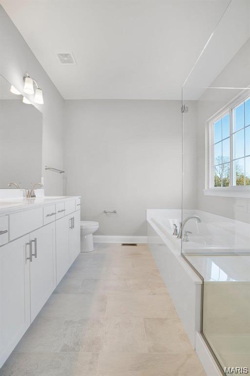 10 Schaper Farms Ct, Foristell, MO 63348 - bathroom featuring vanity and a garden tub