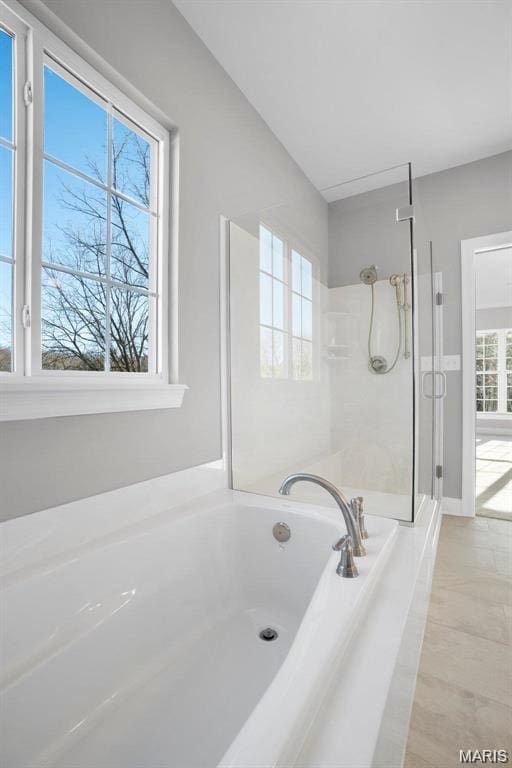 10 Schaper Farms Ct, Foristell, MO 63348 - bathroom featuring a garden tub, a shower stall, and marble finish floors