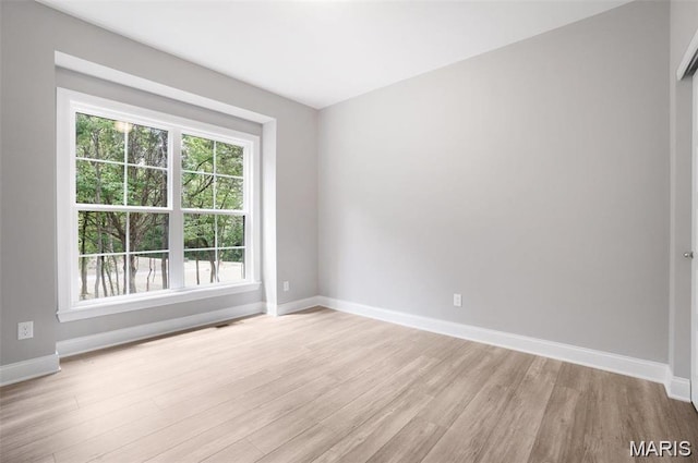 10 Schaper Farms Ct, Foristell, MO 63348 - spare room featuring light wood-style floors and baseboards