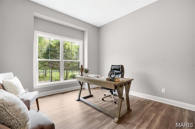 10 Schaper Farms Ct, Foristell, MO 63348 - home office featuring baseboards and wood finished floors