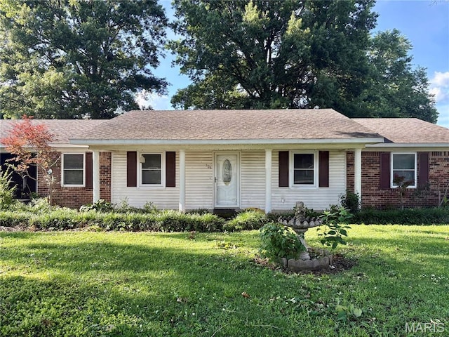 305 Manor, Steele, MO 63877 - ranch-style home with a front yard and brick siding